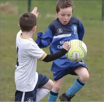  ??  ?? Josh Judge of Boyne Rovers looks for a way past Callum McDonnell of Drogheda Boys.