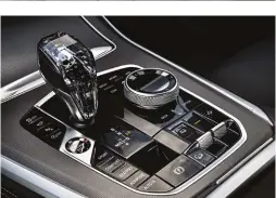  ??  ?? Glass finish bits like the gear selector, the controller, start/stop button and audio system control knob used in the BMW X5 are optional