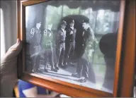  ?? Matthew Brown / Hearst Connecticu­t Media ?? Joseph Havranek looks at a photo taken of him as an Air Policeman when he served in the U.S. Airforce during an interview at his home in Greenwich, Conn. on July 12, 2019. Havranek has been a volunteer for 40 years, and recently stepped down as an auxiliary police officer with the Greenwich Police Department.