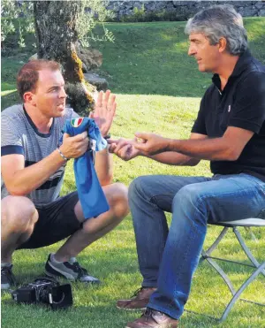  ??  ?? At the feet of a master: Michael Donald interviewi­ng Paolo Rossi and (left) the football legend in action for Italy during the 1982 World Cup