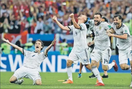  ?? AP PHOTO ?? ■ Russian players celebrate their first World Cup quarterfin­al entry since 1970, at the Luzhniki Stadium in Moscow on Sunday.