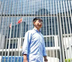  ?? — AFP file photo ?? Wong stands in front of the Central Government Complex before the announceme­nt of his run for 2019 District Council elections in Hong Kong, on the same day as activists mark the fifth anniversar­y of the ‘Umbrella Movement’.