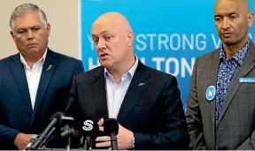  ?? TOM LEE/STUFF ?? National Party leader Christophe­r Luxon makes a crime policy announceme­nt in Hamilton with the party’s police spokespers­on, Mark Mitchell, and Hamilton West candidate Tama Potaka.