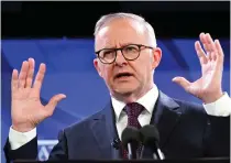  ?? AAP FILE PHOTO VIA AP ?? ‘HARSH SENTENCE’
Australia’s Prime Minister Anthony Albanese raises his hands during his address at the National Press Club in the capital Canberra on Feb. 22, 2023.
