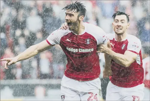  ??  ?? Rotherham United loanee Keiffer Moore celebrates with Richie Towell after scoring against Northampto­n, one of nine goals the Ipswich man has netted so far.
