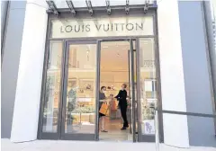  ??  ?? A customer is seen at Louis Vuitton shop in Monte Carlo, Monaco on Thursday.