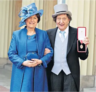  ??  ?? Good Knight: Ken Dodd, who died in the same home in which he was born, top right, received a knighthood in 2017