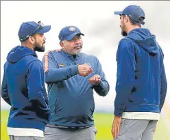  ?? AP ?? Bharat Arun (centre) said that they are keeping a close tab on bowlers’ regimen during the lockdown.