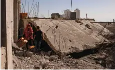  ?? AFP ?? Residents take their belongings from a house demolished by Israeli authoritie­s in Bani Naim, in the occupied West Bank