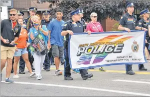  ?? ELIZABETH PATTERSON/CAPE BRETON POST ?? Uniformed and out-of-uniform members of the Cape Breton Regional Police were among those taking part in Saturday’s Pride Cape Breton Parade in Sydney.