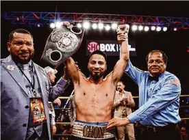  ?? Stephanie Trapp/showtime ?? Ramon Cardenas, center, handed No. 4-ranked Israel Rodriguez Picazo his first loss since 2019 after shattering his jaw with a right hand in the sixth round.