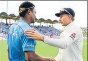  ?? GETTY ?? Joe Root and Shannon Gabriel shake hands after the match.