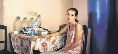  ?? PHOTOS: REUTERS ?? Faces of hardship: Yaneidi Guzman at home in Caracas and Maria Guitia with her son.