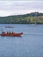  ?? ?? The RNLI accompany the Herbert John as it makes its way around Lamlash Bay. 01_B20lifeboa­t01