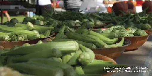  ??  ?? Produce grown locally by Horace Brittain adds
color to the GreenMarke­t every Saturday.