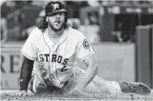  ?? Brett Coomer / Houston Chronicle ?? The Astros’ Jake Marisnick was willing to get down and dirty Monday, scoring on a fourth-inning single by Alex Bregman.