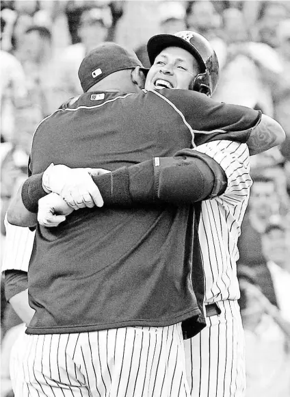  ?? BRAD PENNER, USA TODAY SPORTS ?? Yankees pitcher CC Sabathia, left, hugs Alex Rodriguez on June 19 after Rodriguez hit a home run for his 3,000th career hit. “I just hope to finish my career doing the right things,” Rodriguez says.