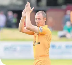  ??  ?? Livingston player-boss Kenny Miller acknowledg­es the fans