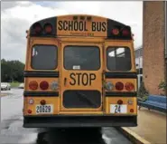  ?? HARLEY MARSH — THE MORNING JOURNAL ?? A school bus sits outside of a high school.