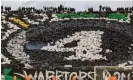  ?? AFP/Getty Images ?? Raja fans display the No 4 during the CAF Champions League quarter-final with with Egypt's Al-Ahly. Photograph: Fadel Senna/