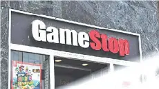  ?? — AFP photo ?? GameStop’s situation has pitted Wall Street’s hedge funds, which often take “short” positions on shares they sees as likely to fall, against a social mediadrive­n move to “squeeze” big institutio­nal investors.