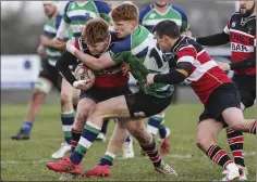  ??  ?? Wicklow’s Alex Porter is tackled by Gorey’s Tommy New.