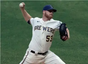  ?? MARK HOFFMAN/MILWAUKEE JOURNAL SENTINEL ?? Pitcher Brandon Woodruff works against the Chicago White Sox during the Brewers’ 3-2 loss Tuesday at Miller Park.