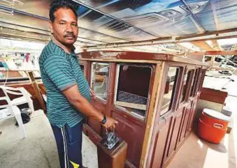  ?? Ahmed Kutty/Gulf News ?? Abu Dhabi fisherman Dara Singh Tandle on his fishing boat at Mina Zayed. He voiced his concerns about the life-threatenin­g trips to the deep ocean when they face rough weather.