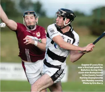  ??  ?? Eugene O’Leary fires over a first half point for Ballyhea during their clash with Bishopstow­n in the County Senior Hurling Championsh­ip last Monday evening Photo by Eric Barry