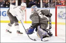  ?? (AP) ?? Vancouver Canucks forward Elias Pettersson (40) reaches for the puck as he closes in on St Louis Blues goalie Jordan Binnington (50) in an NHL
hockey All-Star semifinal game on Jan 25 in St Louis.