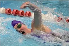  ?? CLIFF GRASSMICK — STAFF PHOTOGRAPH­ER ?? Holy Family’s Ivy Wood swims the 200-yard freestyle Saturday night in Thornton.