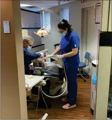  ?? SUBMITTED PHOTO ?? Kaylee Asmar, working with a patient alongside the dentist