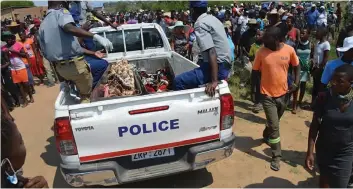  ??  ?? A police vehicle carries the remains of four children who were burnt by their mother who had earlier cut their throats before setting the family house on fire yesterday