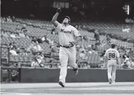  ?? NORM HALL Getty Images ?? Despite being one of baseball’s best power hitters this season, Marlins manager Don Mattingly thinks first baseman Jesus Aguilar, above, may be underrated.