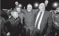  ?? REUTERS ?? Stanley manager John Coleman (center) savors the moment with fans after winning promotion.