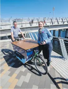  ?? DARREN STONE, TIMES COLONIST ?? Corey Burger and Meredith James of Capital Bike, a merger of the Greater Victoria Cycling Coalition and the Great Victoria Bike to Work Society.