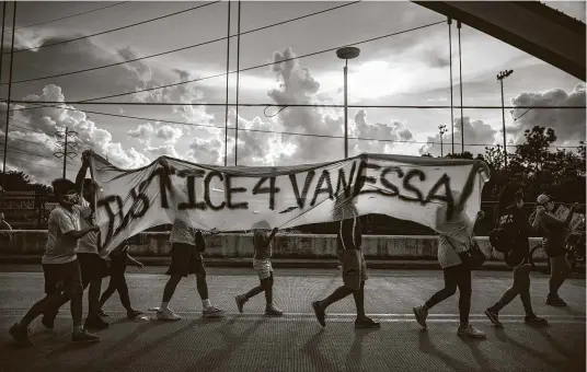  ?? Photos by Marie D. De Jesús / Staff photograph­er ?? Protesters demand justice for Army Spc. Vanessa Guillén as they march Wednesday on the Dunlavy Street bridge over the Southwest Freeway.