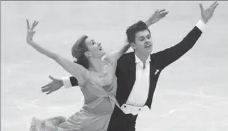  ?? CHIANG YING-YING, THE ASSOCIATED PRESS ?? Carolane Soucisse and Shane Firus of Canada perform their free program in the ice dance event at the ISU Four Continents Figure Skating Championsh­ips in Taipei on Thursday.