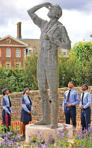  ?? ?? Commemorat­ion: RAF Air Cadets visit the garden before its public opening tomorrow