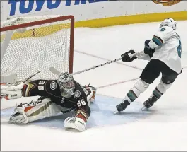  ?? REED SAXON — THE ASSOCIATED PRESS ?? The Sharks’ Joe Pavelski beats Anaheim Ducks goalie John Gibson in Sunday’s shootout.