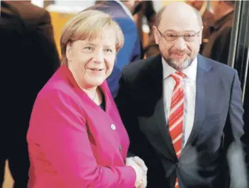  ?? FOTO REUTERS ?? Angela Merkel se reunió el 7 de enero con Martin Schulz, líder socialdemó­crata.