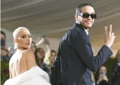 ?? EVAN AGOSTINI/INVISION ?? Kim Kardashian, wearing Marilyn Monroe’s gown, and Pete Davidson attend the Met gala May 2 in New York. The couple broke up in August.