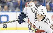  ?? CHRIS O'MEARA/AP ?? Florida Panthers center Derek MacKenzie chases the puck during the first period of Friday’s game in Tampa.