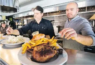  ?? GIOVANNI CAPRIOTTI FILES ?? Chez Tousignant is fast food made from scratch and done right by Yann Turcotte, far left, Michele Forgione and Stefano Faita, shown preparing a roast chicken platter.