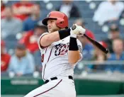  ?? / File - Getty Images ?? Making his first appearance in his home park, former Walton standout Spencer Kieboom had the best game of his young big league career.