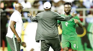  ??  ?? Anthony Okpotu (right) celebrates with Coaches Salisu Yusuf and Imama Amapakabo after scoring Nigeria’s opening goal in the 2-0 defeat of Ghana at the WAFU Cup…on Monday.