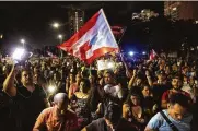  ?? ERIKA P. RODRIGUEZ / THE NEW YORK TIMES ?? Demonstrat­ors protest outside the Department of Justice in San Juan on Monday. Ousted Gov. Ricardo Rosselló has chosen Pedro Pierluisi as his likely successor when his resignatio­n becomes effective.