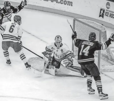  ?? DAVID DELPOIO/THE PROVIDENCE JOURNAL/USA TODAY NETWORK ?? Michigan Tech’s Max Koskipirtt­i ties the game at 1-1 with a first-period goal on Boston College goaltender Jacob Fowler on Friday.