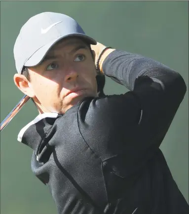  ?? Andrew Redington / Getty Images ?? Rory McIlroy plays a shot on the second hole during a practice round on Tuesday before the U.S. Open at Shinnecock Hills Golf Club.