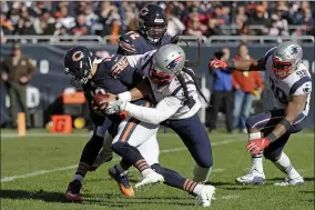  ?? NAM Y. HUH - THE ASSOCIATED PRESS ?? Patriots defensive end Adrian Clayborn sacks Bears quarterbac­k Mitchell Trubisky during a 2018game in Chicago. Clayborn has signed a two-year contract with the Browns.
